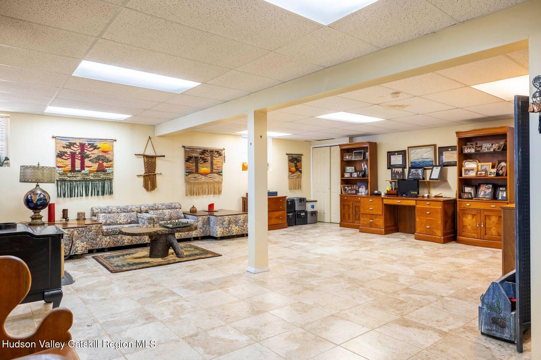 406 Cheese Hill Road Preston Hollow, NY 12469 - Photo 43 of 59 a living room with furniture window and a flat screen tv