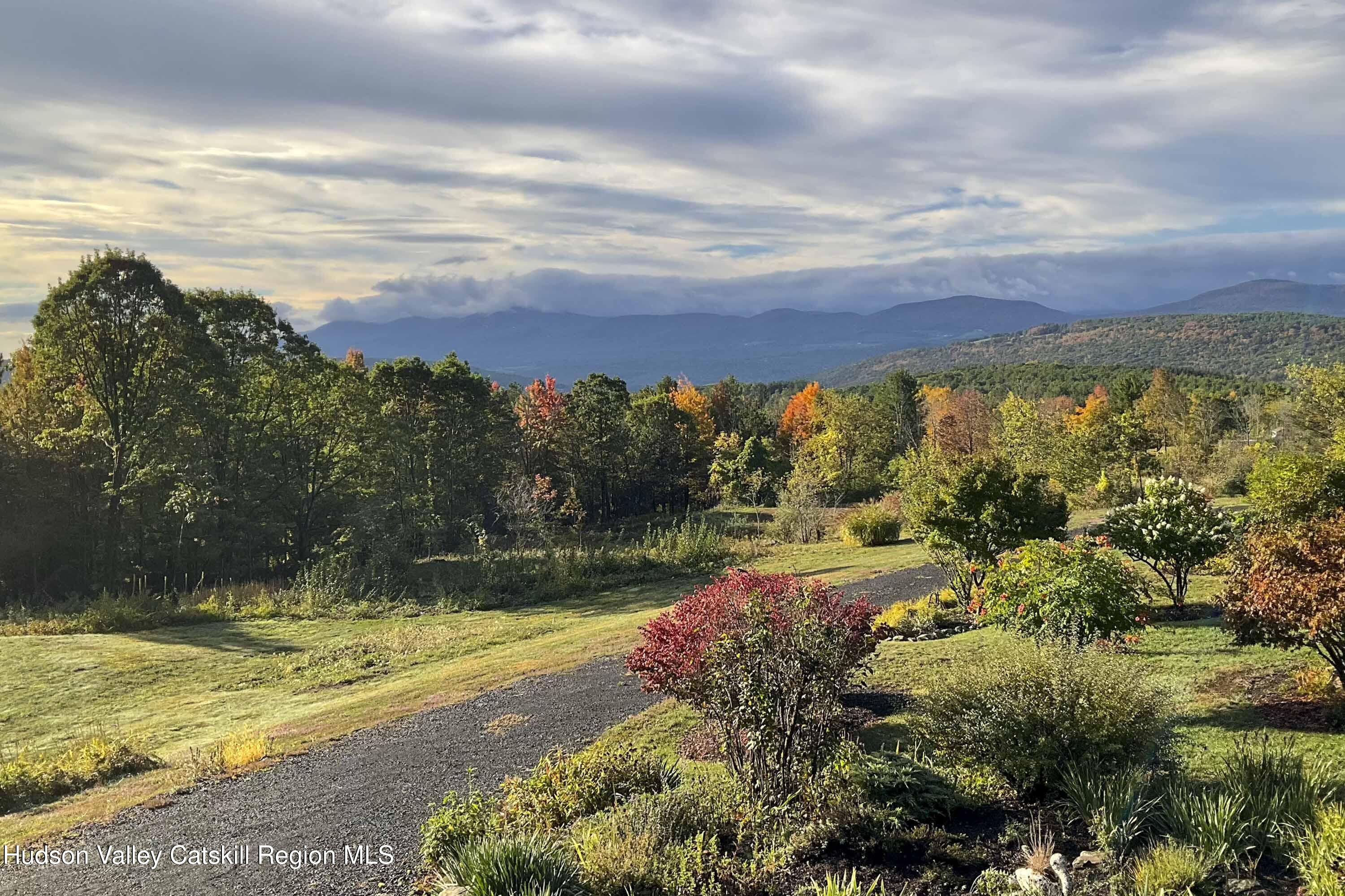 406 Cheese Hill Road Preston Hollow, NY 12469 - Photo 57 of 59 a view of a lake with a building in the background