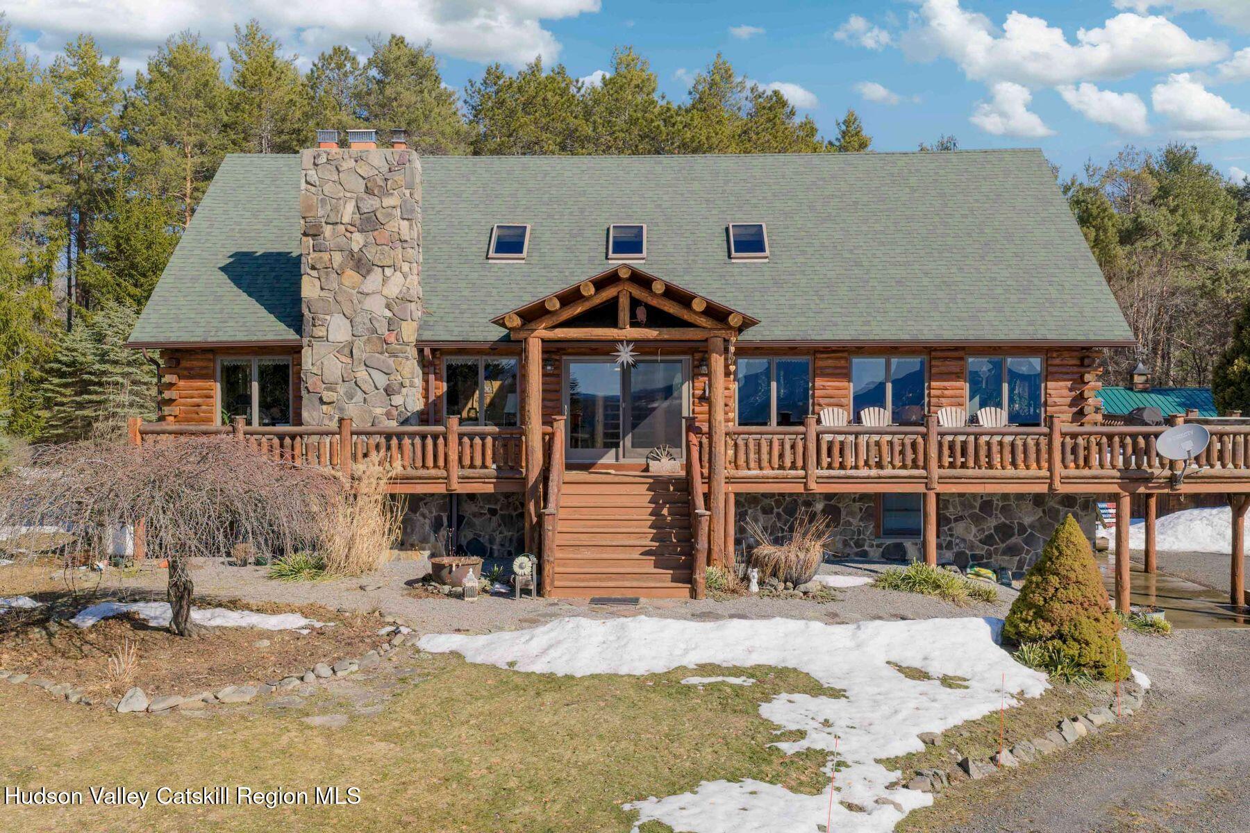 406 Cheese Hill Road Preston Hollow, NY 12469 - Photo 6 of 59 a front view of a house with a yard