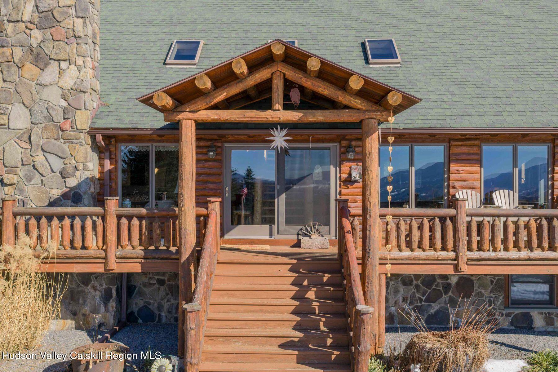 406 Cheese Hill Road Preston Hollow, NY 12469 - Photo 7 of 59 a front view of a house with a porch
