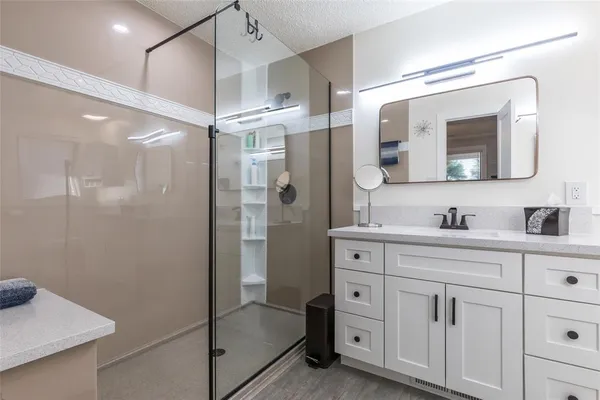 a kitchen with stainless steel appliances granite countertop a refrigerator and a stove