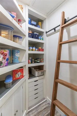 a kitchen with a stove and a white cabinets