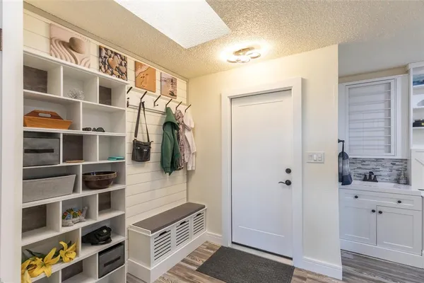 a living room with furniture a ceiling fan and a rug