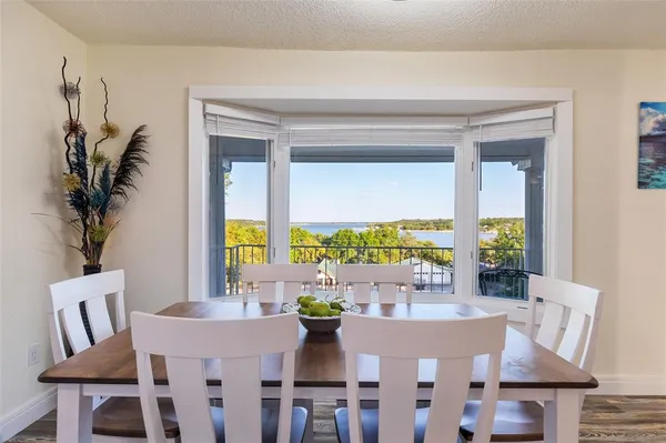 a view of a dining room with furniture window and outside view