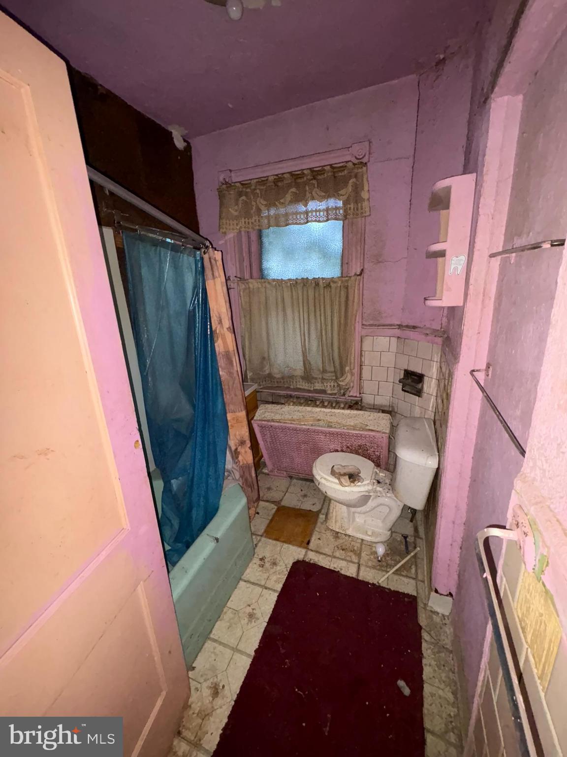 350 North 61st Street Philadelphia, PA 19139 - Photo 13 of 21 a living room with furniture and a rug