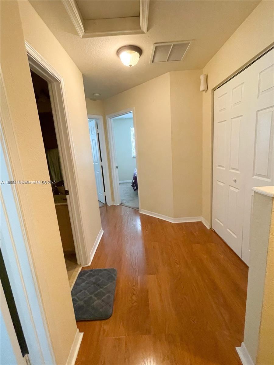 5907 London Lane, Unit 5907 Tamarac, FL 33321 - Photo 9 of 10 a view of entryway with wooden floor