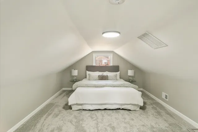 a large white bed in a white room