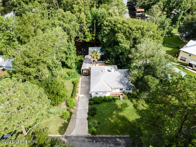 2040 Cornell Road Middleburg, FL 32068 - Photo 58 of 65 a view of a yard with plants and large trees