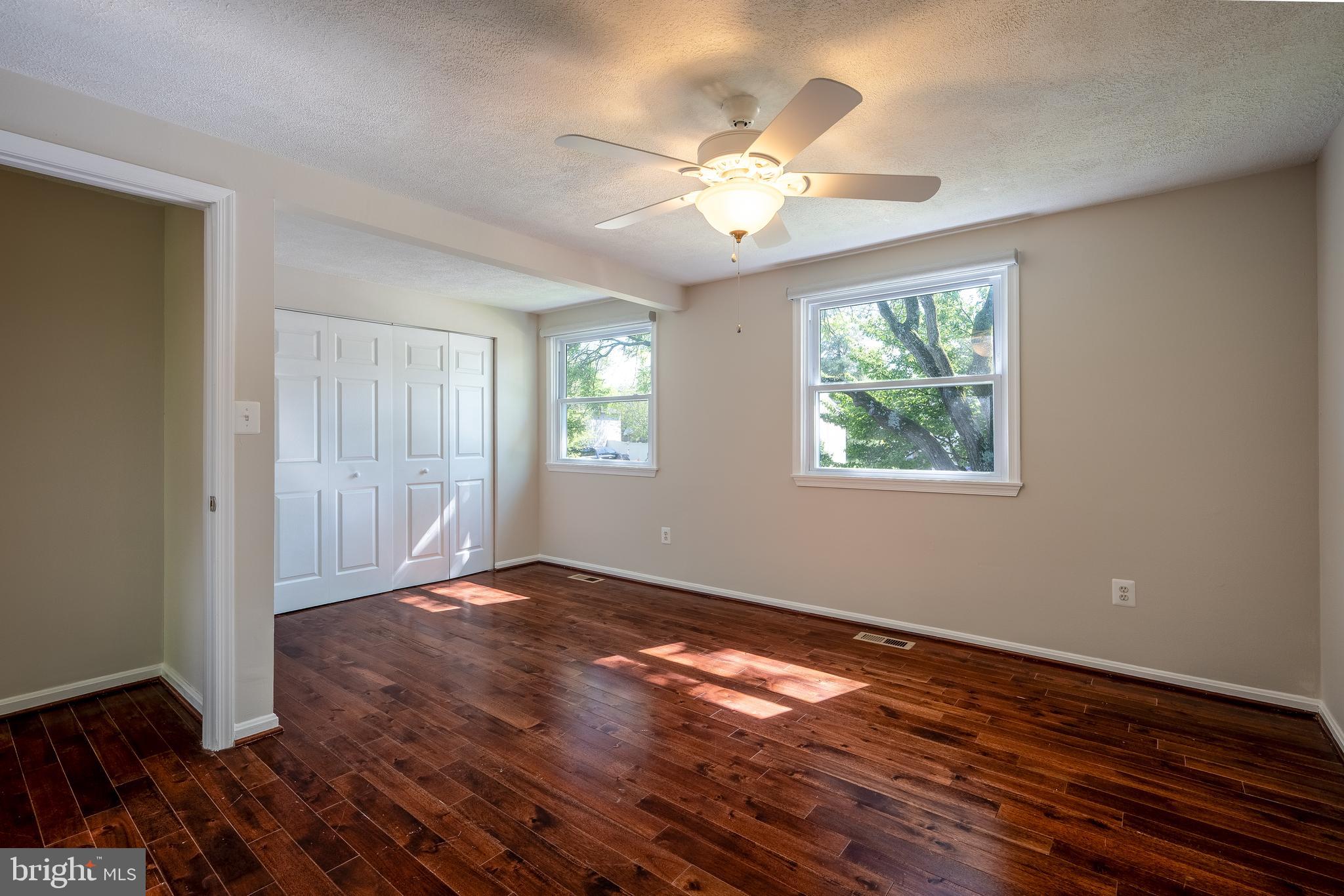 1784 Valleyside Drive Frederick, MD 21702 - Photo 11 of 42 a view of an empty room with wooden floor and a window