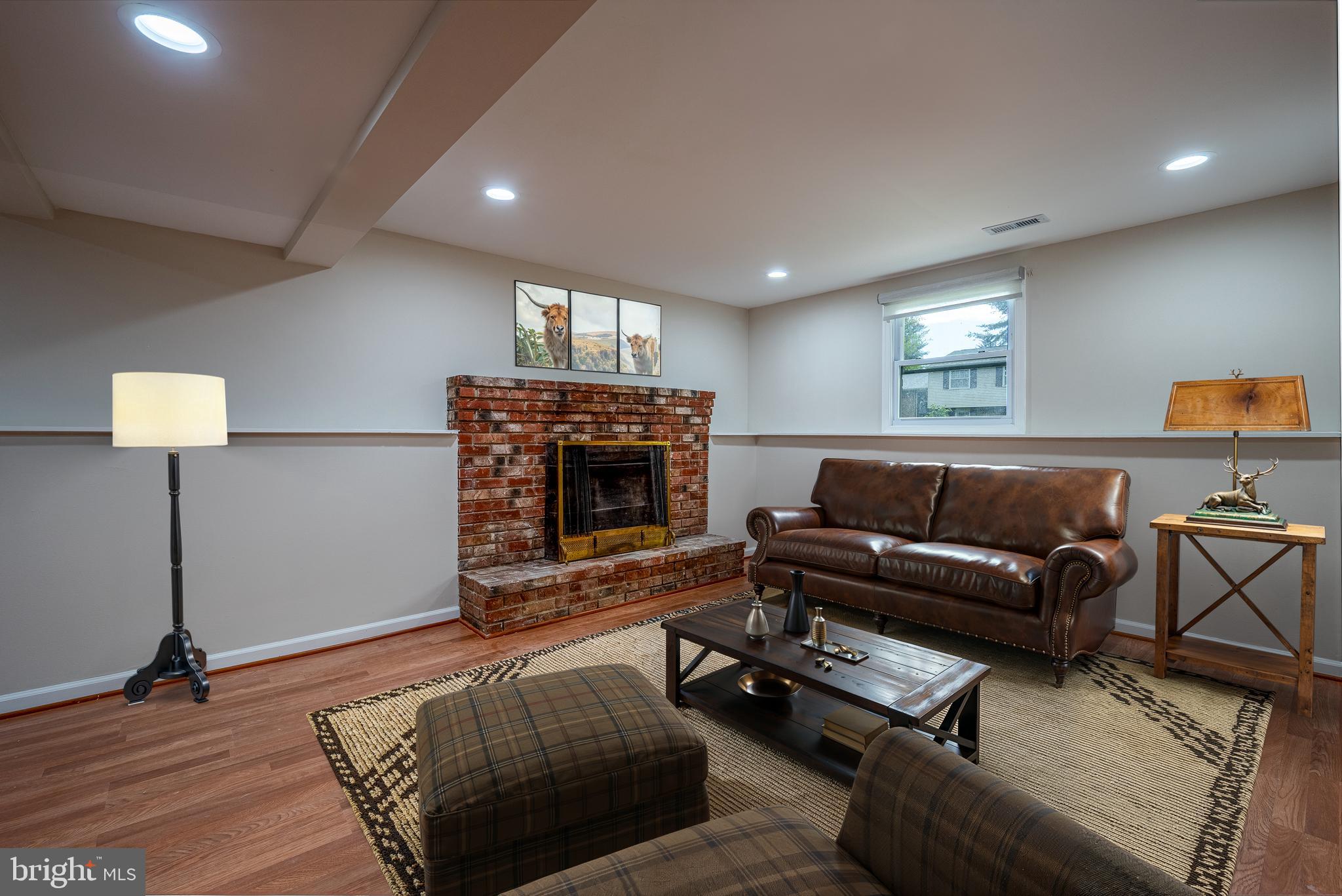 1784 Valleyside Drive Frederick, MD 21702 - Photo 18 of 42 a living room with furniture and a fireplace