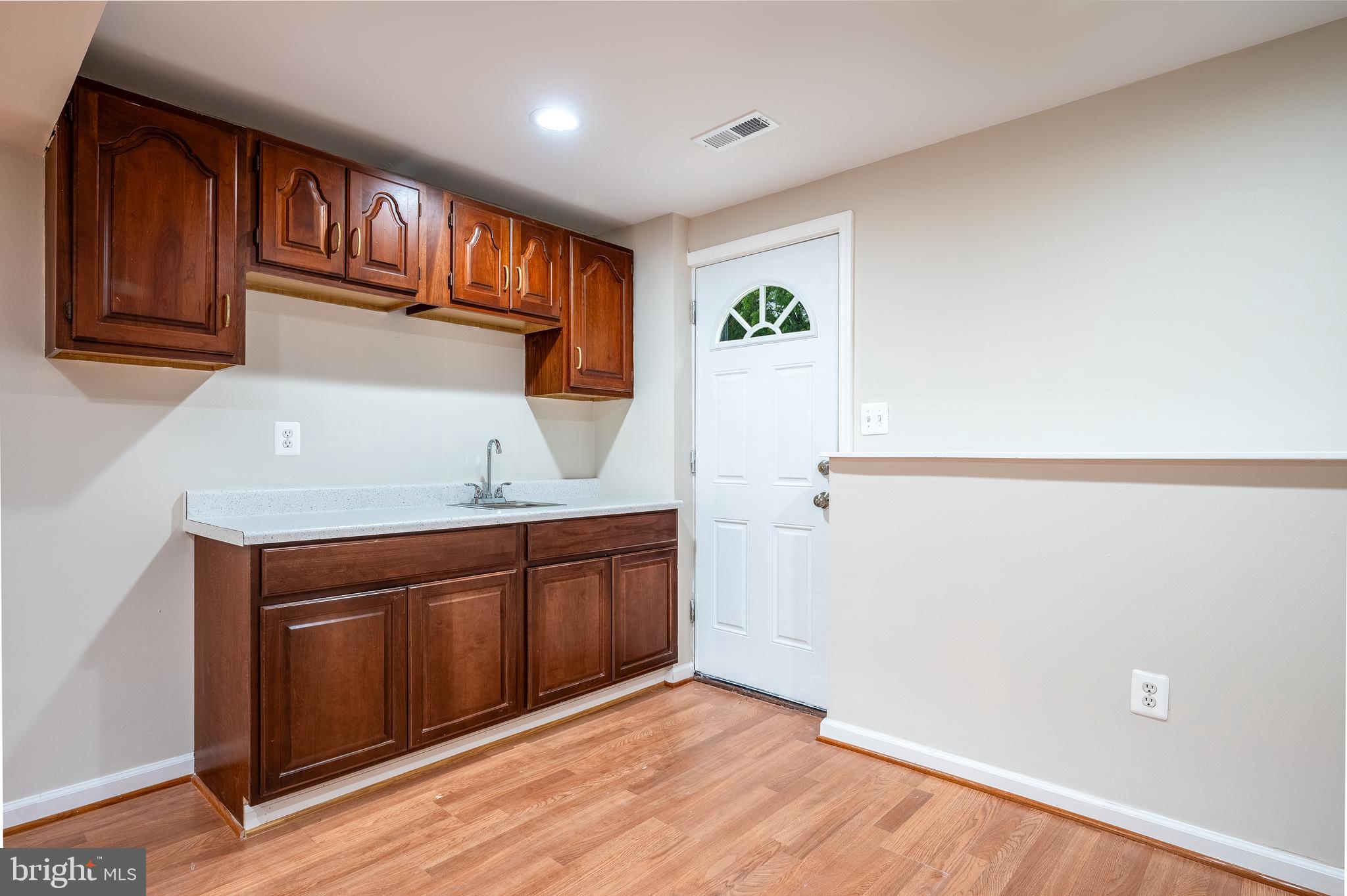 1784 Valleyside Drive Frederick, MD 21702 - Photo 23 of 42 a kitchen with granite countertop cabinets stainless steel appliances and a sink