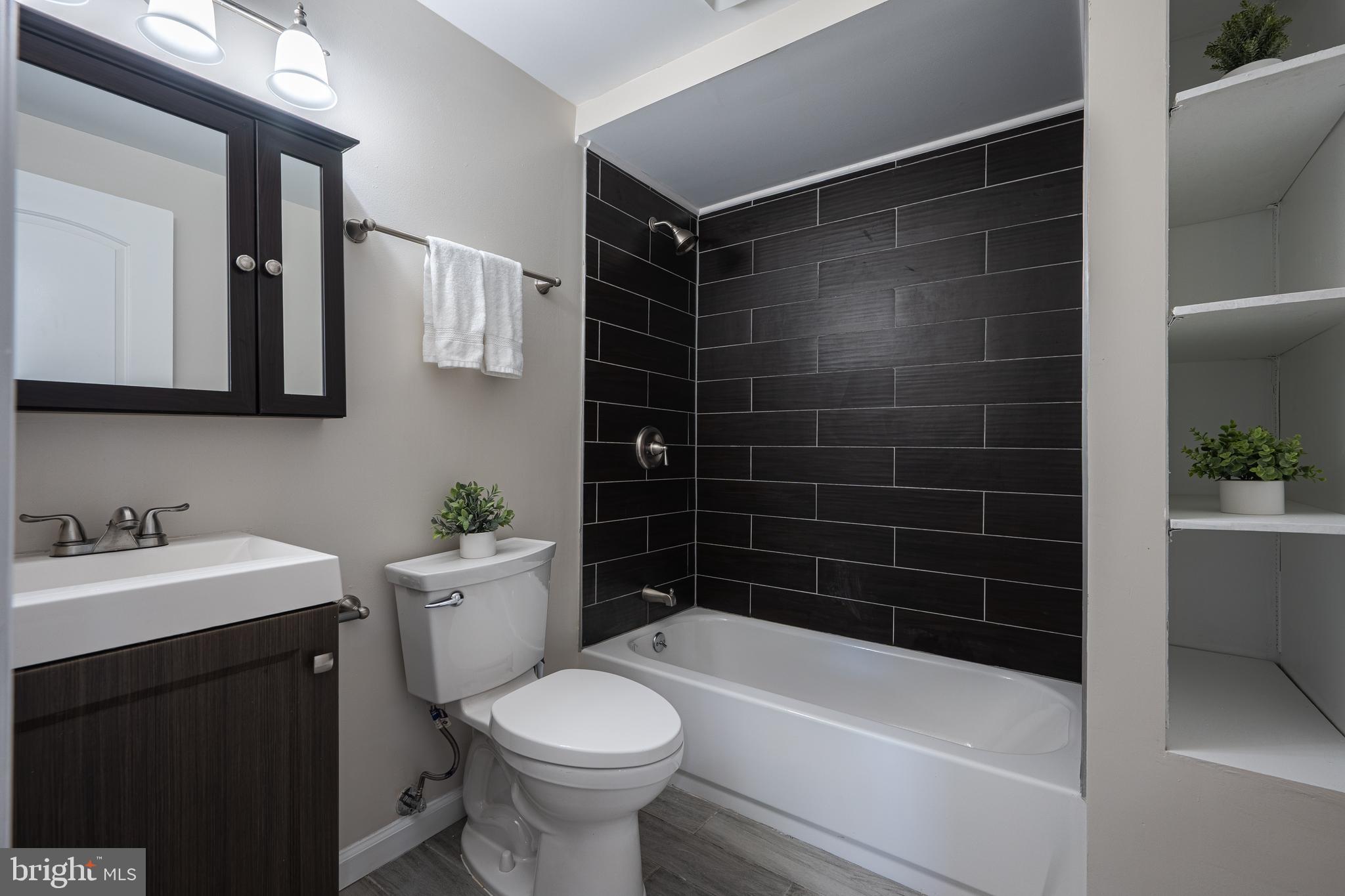 1784 Valleyside Drive Frederick, MD 21702 - Photo 25 of 42 a bathroom with a sink a toilet and shower