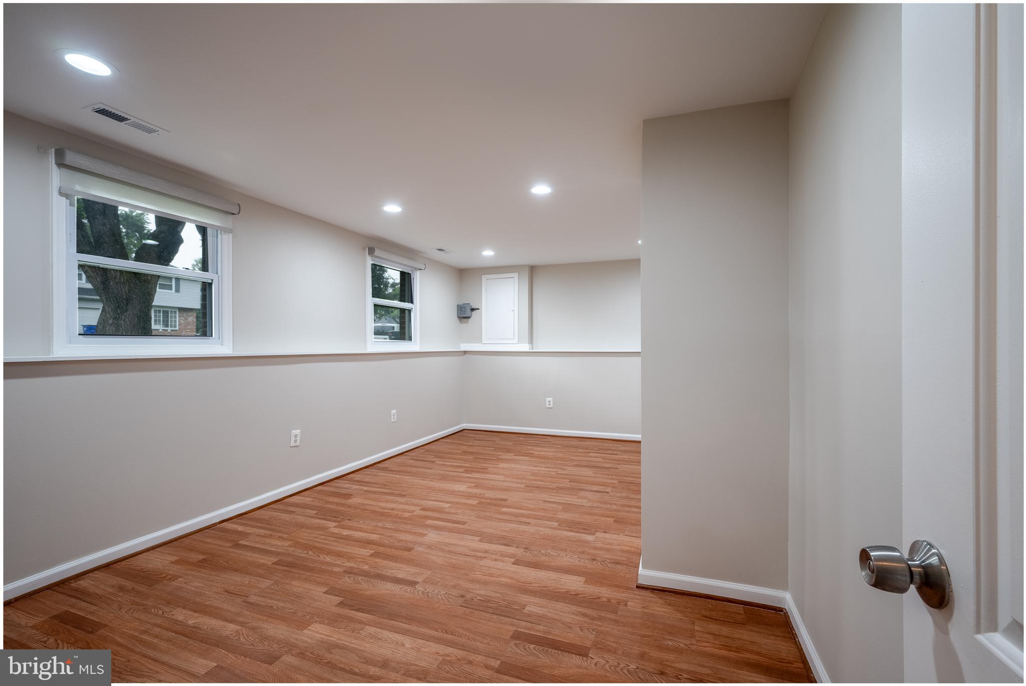 1784 Valleyside Drive Frederick, MD 21702 - Photo 26 of 42 a view of an empty room with wooden floor and a window
