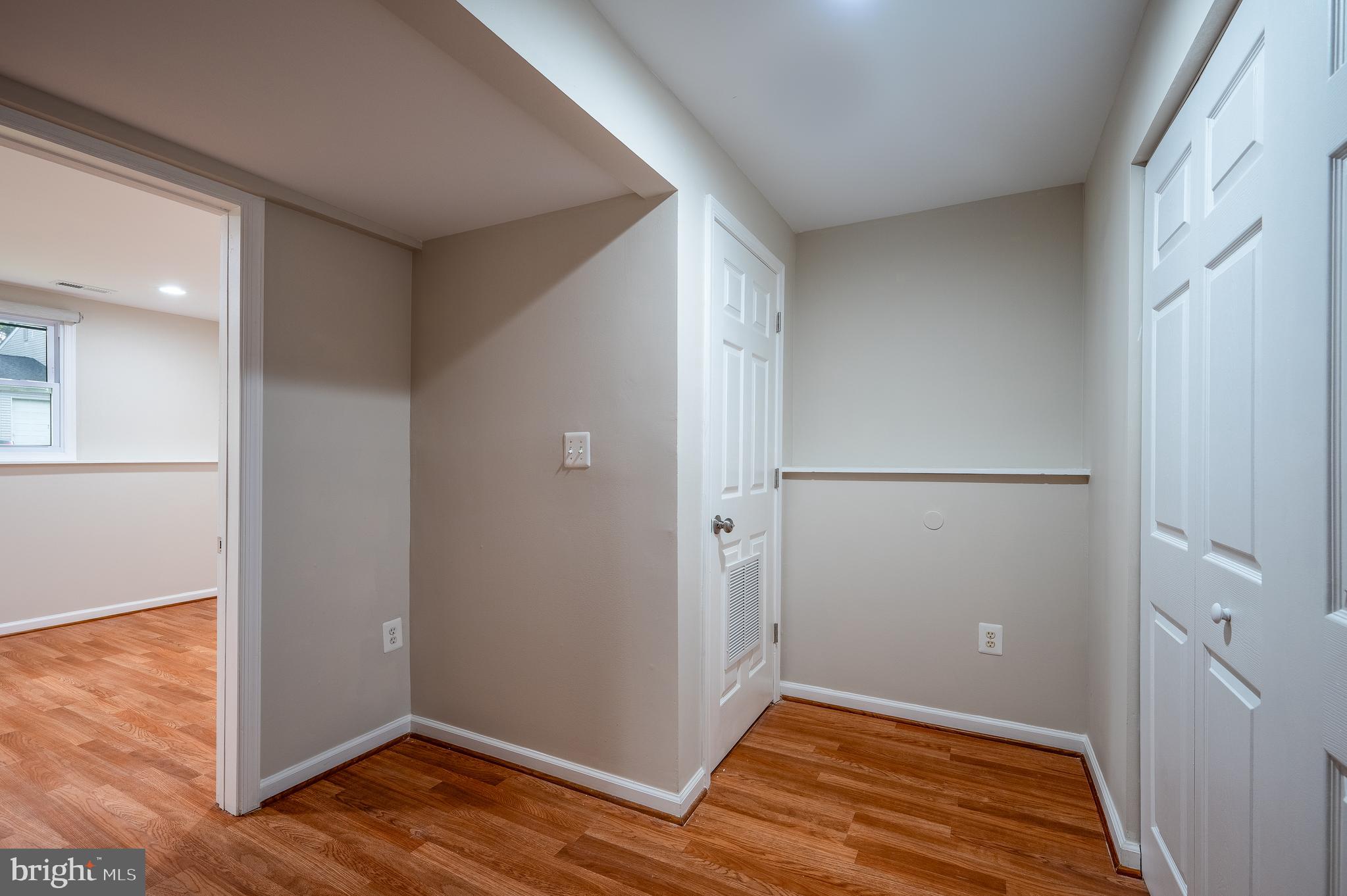 1784 Valleyside Drive Frederick, MD 21702 - Photo 28 of 42 an empty room with wooden floor and closet