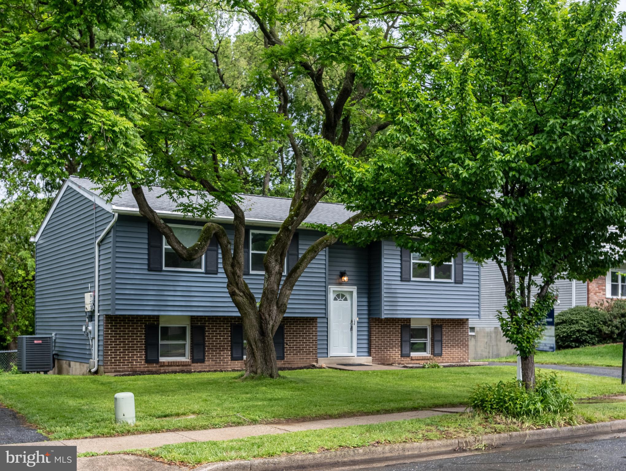 1784 Valleyside Drive Frederick, MD 21702 - Photo 33 of 42 a front view of a house with a garden