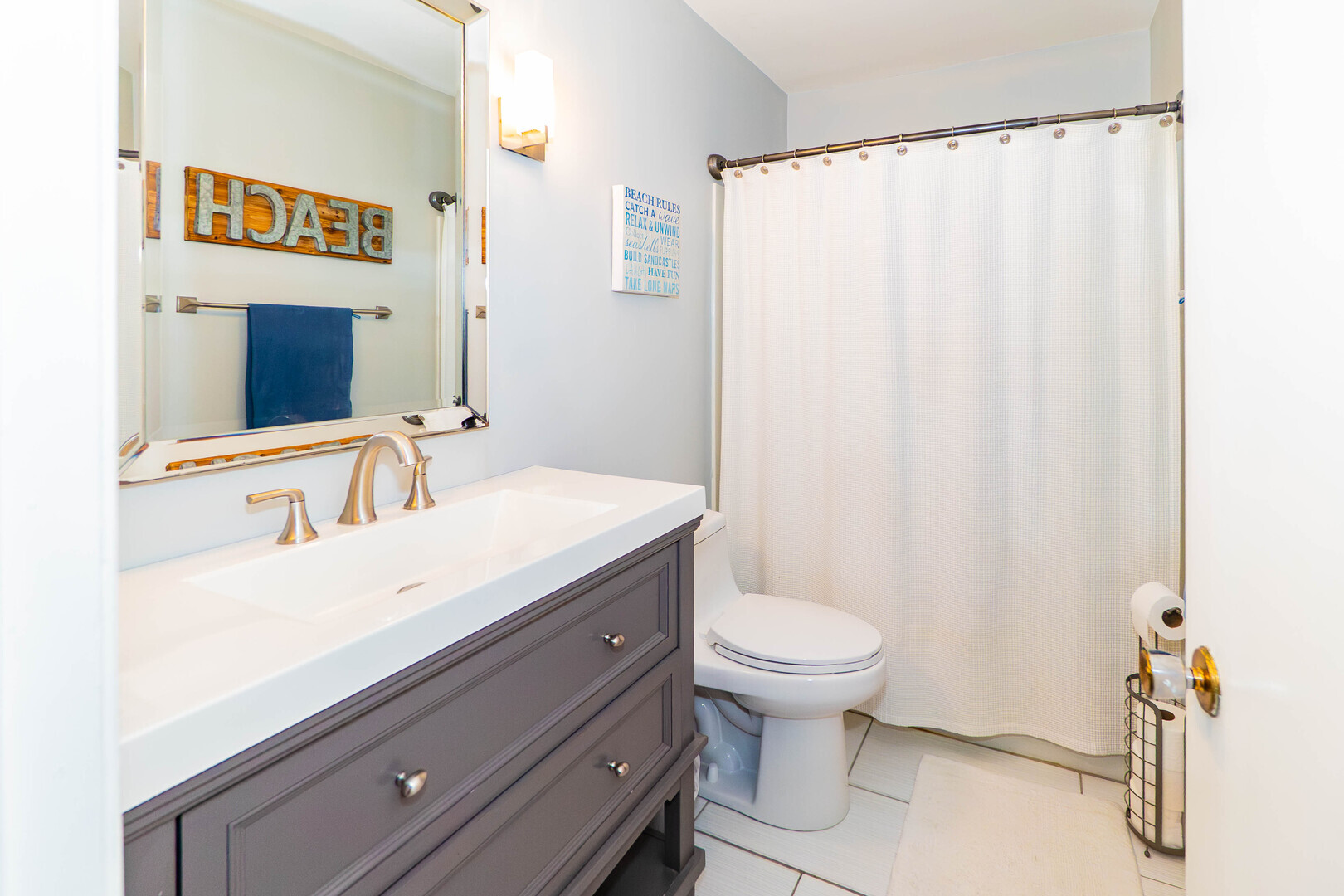 1000-1008 Carrie Avenue Rochelle, IL 61068 - Photo 9 of 20 a bathroom with a sink a toilet and a mirror