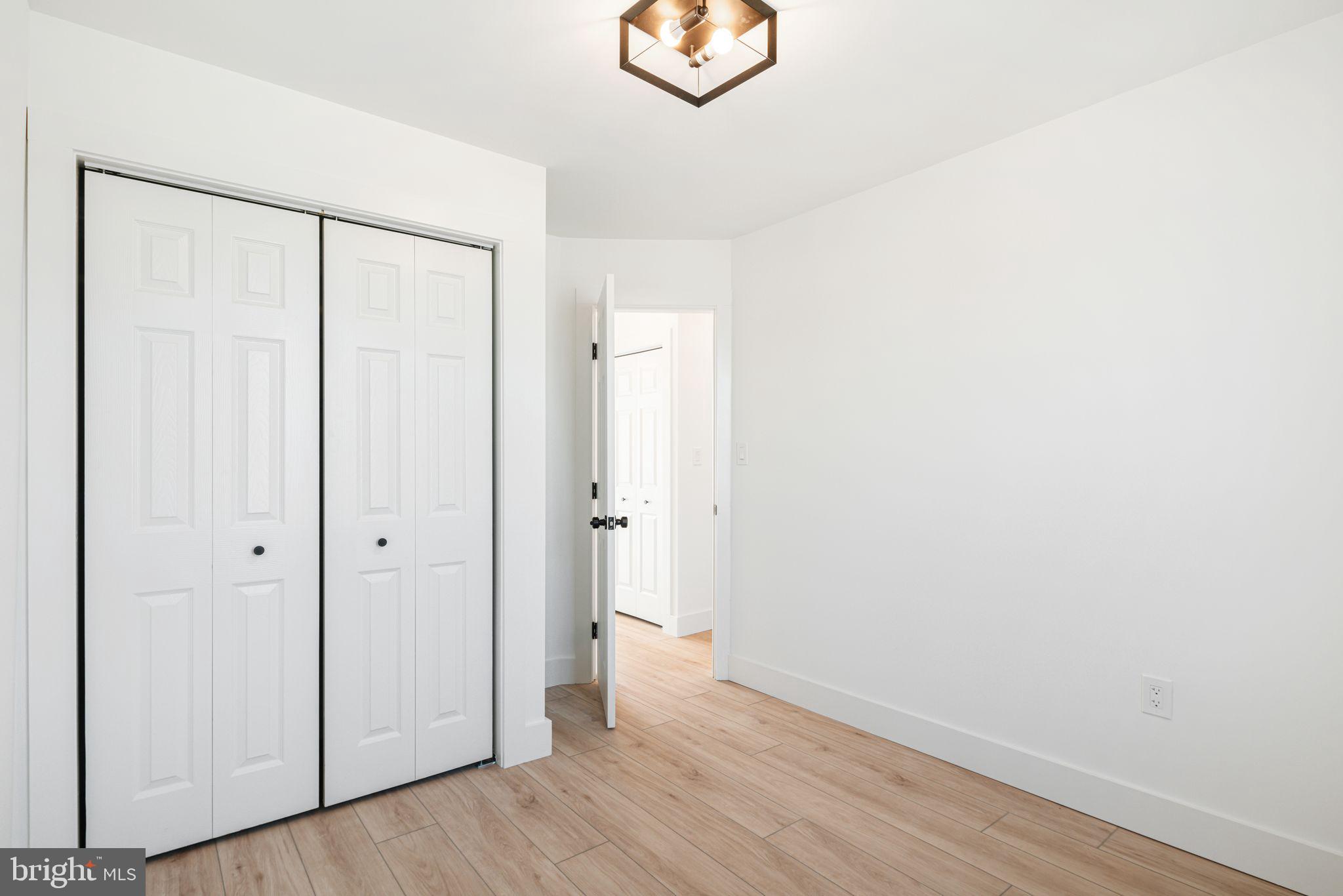 448 Markle Street Philadelphia, PA 19128 - Photo 12 of 21 a view of an empty room with wooden floor and a window