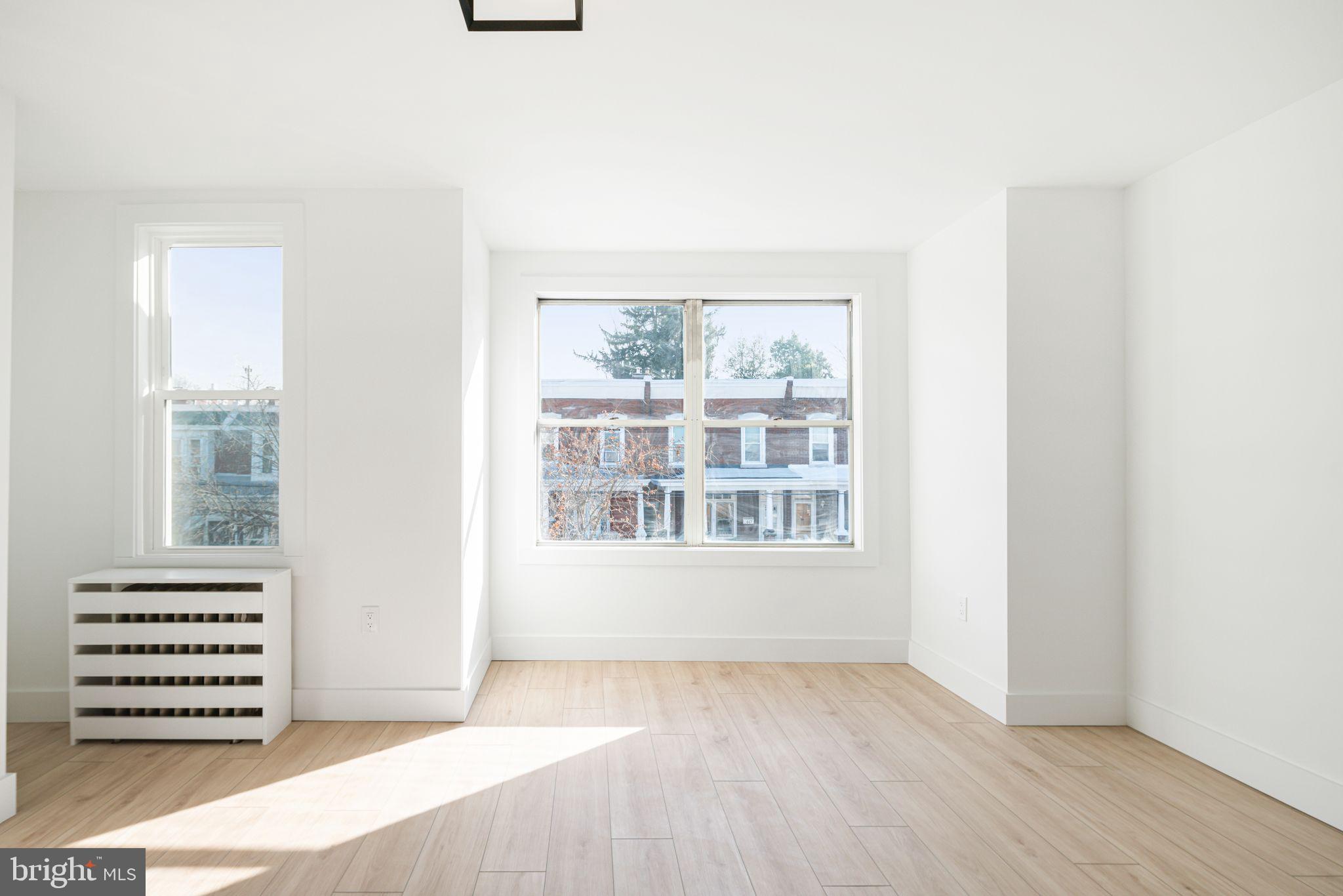 448 Markle Street Philadelphia, PA 19128 - Photo 14 of 21 an empty room with a window and a mirror