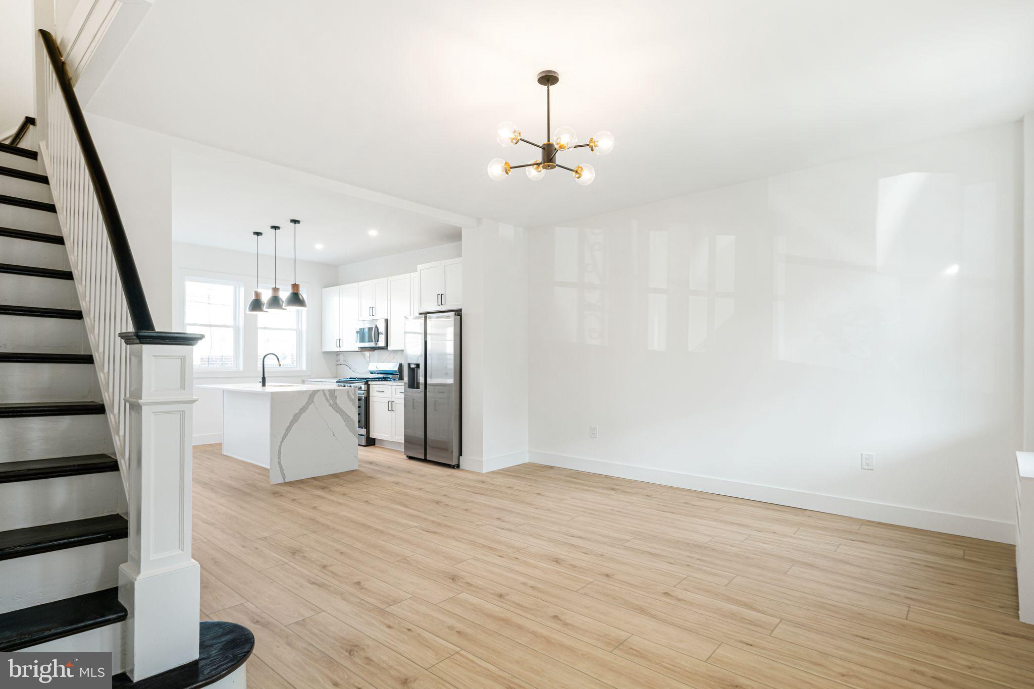 448 Markle Street Philadelphia, PA 19128 - Photo 4 of 21 a view of a kitchen with wooden floor and electronic appliances
