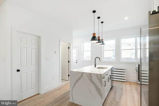 a very nice looking kitchen with a large window