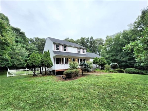 74 Lackey Dam Road Sutton, MA 01590 - Photo 1 of 17 a front view of a house with garden