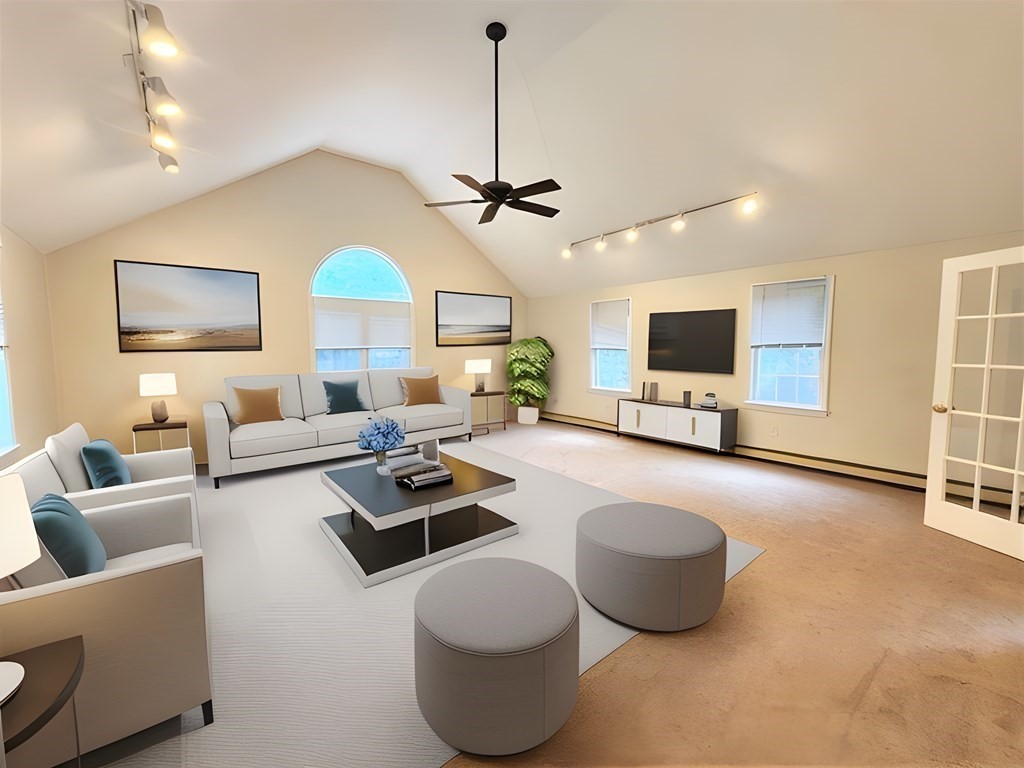 74 Lackey Dam Road Sutton, MA 01590 - Photo 11 of 17 a living room with furniture and a flat screen tv