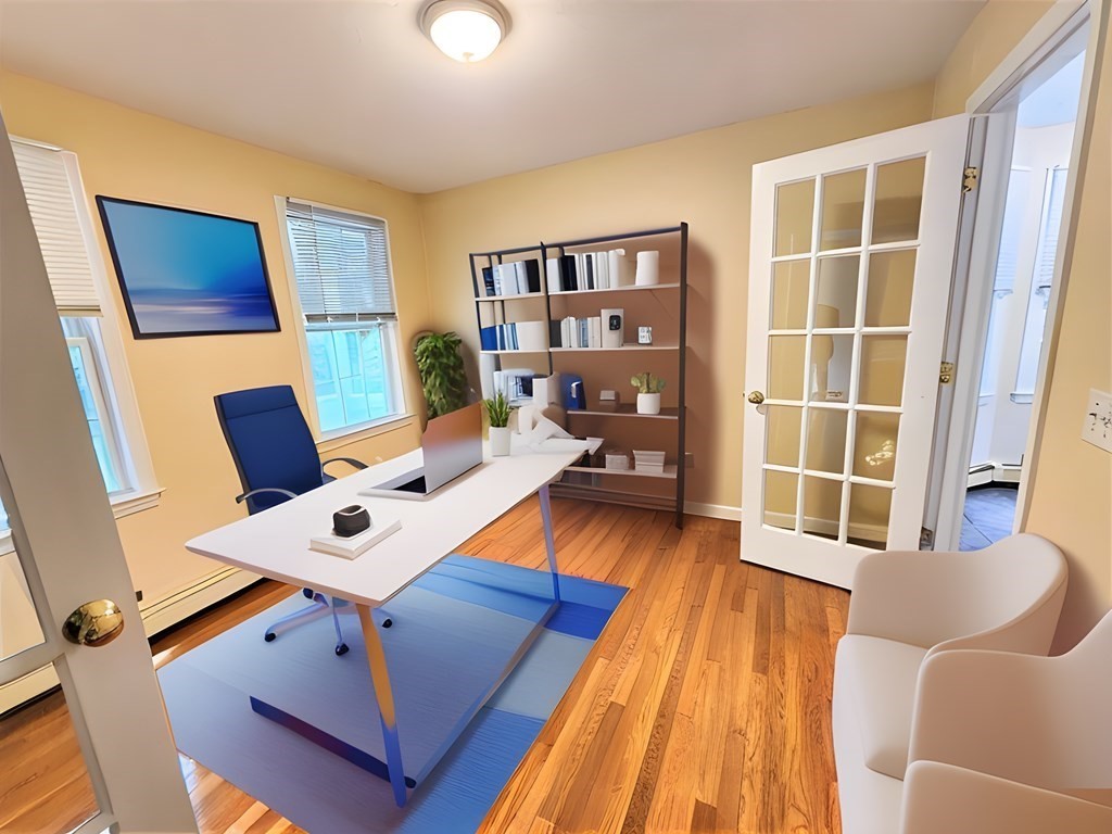 74 Lackey Dam Road Sutton, MA 01590 - Photo 12 of 17 a living room with furniture and a wooden floor