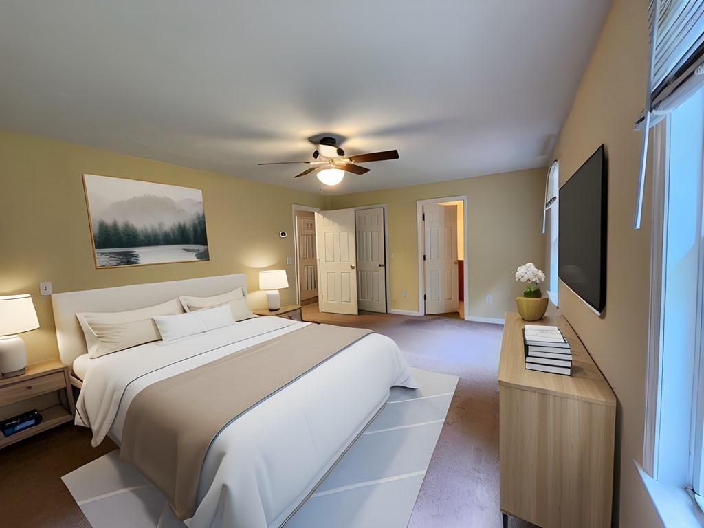 74 Lackey Dam Road Sutton, MA 01590 - Photo 15 of 17 a bedroom with a bed and a flat screen tv