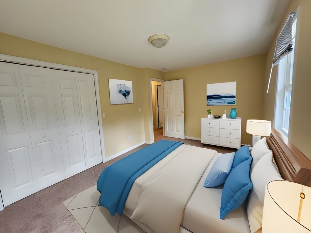 74 Lackey Dam Road Sutton, MA 01590 - Photo 16 of 17 a bedroom with a bed and a couch