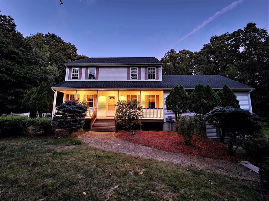 74 Lackey Dam Road Sutton, MA 01590 - Photo 2 of 17 a view of a house with swimming pool and sitting area