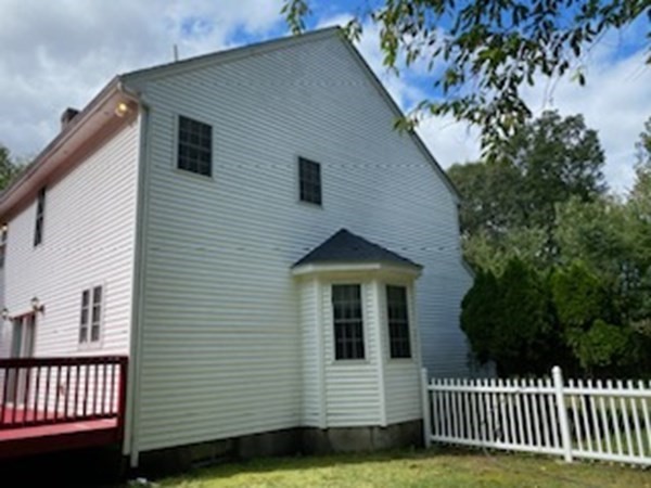 74 Lackey Dam Road Sutton, MA 01590 - Photo 4 of 17 a view of a house with a yard