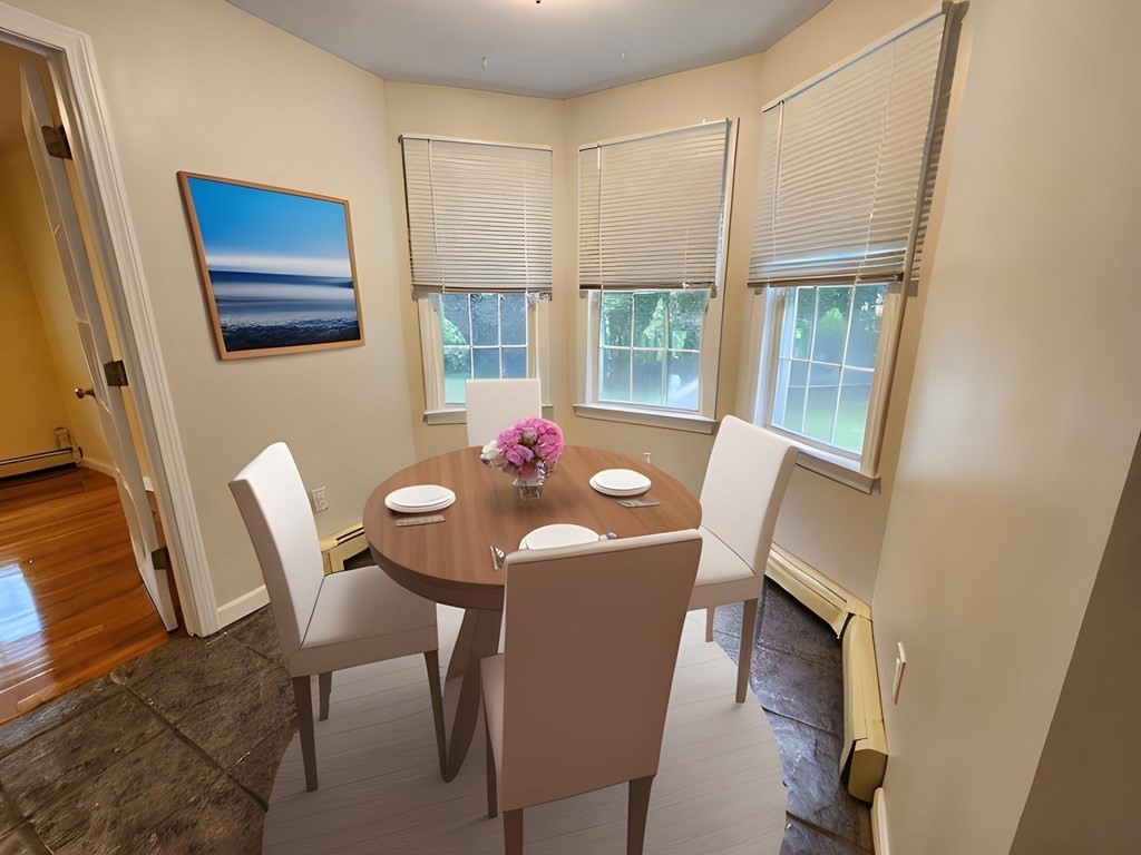 74 Lackey Dam Road Sutton, MA 01590 - Photo 8 of 17 a view of a dining room with furniture window and wooden floor