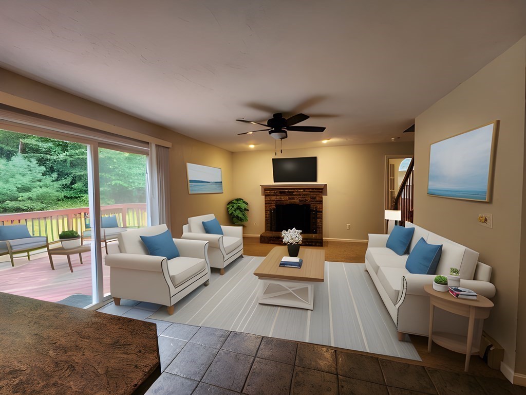 74 Lackey Dam Road Sutton, MA 01590 - Photo 9 of 17 a living room with fireplace furniture and a flat screen tv