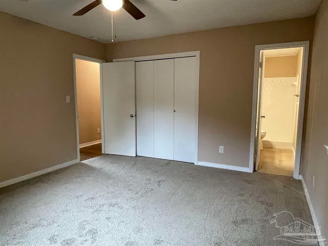 an empty room with closet area