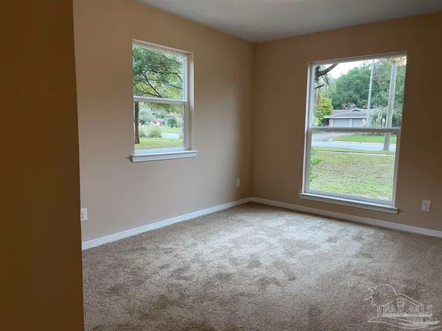 a view of an empty room with a window