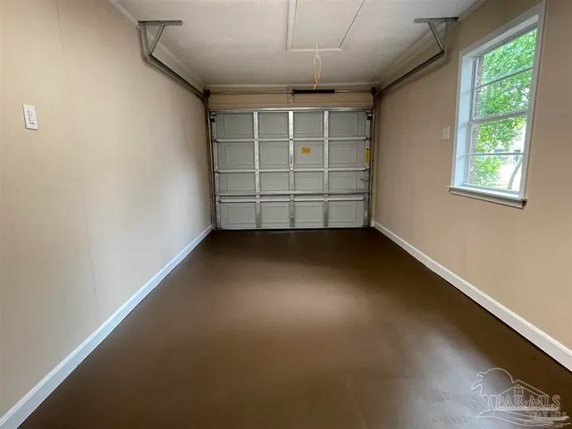 a view of a yard in front of a house with large trees
