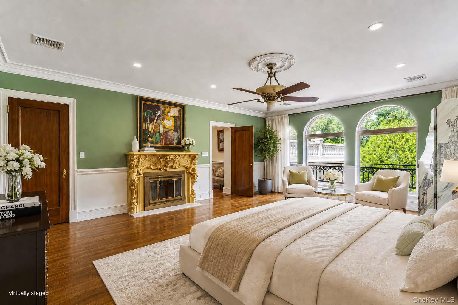 952 Cedar Swamp Road Glen Head, NY 11545 - Photo 22 of 47 a bedroom with a bed and a fireplace