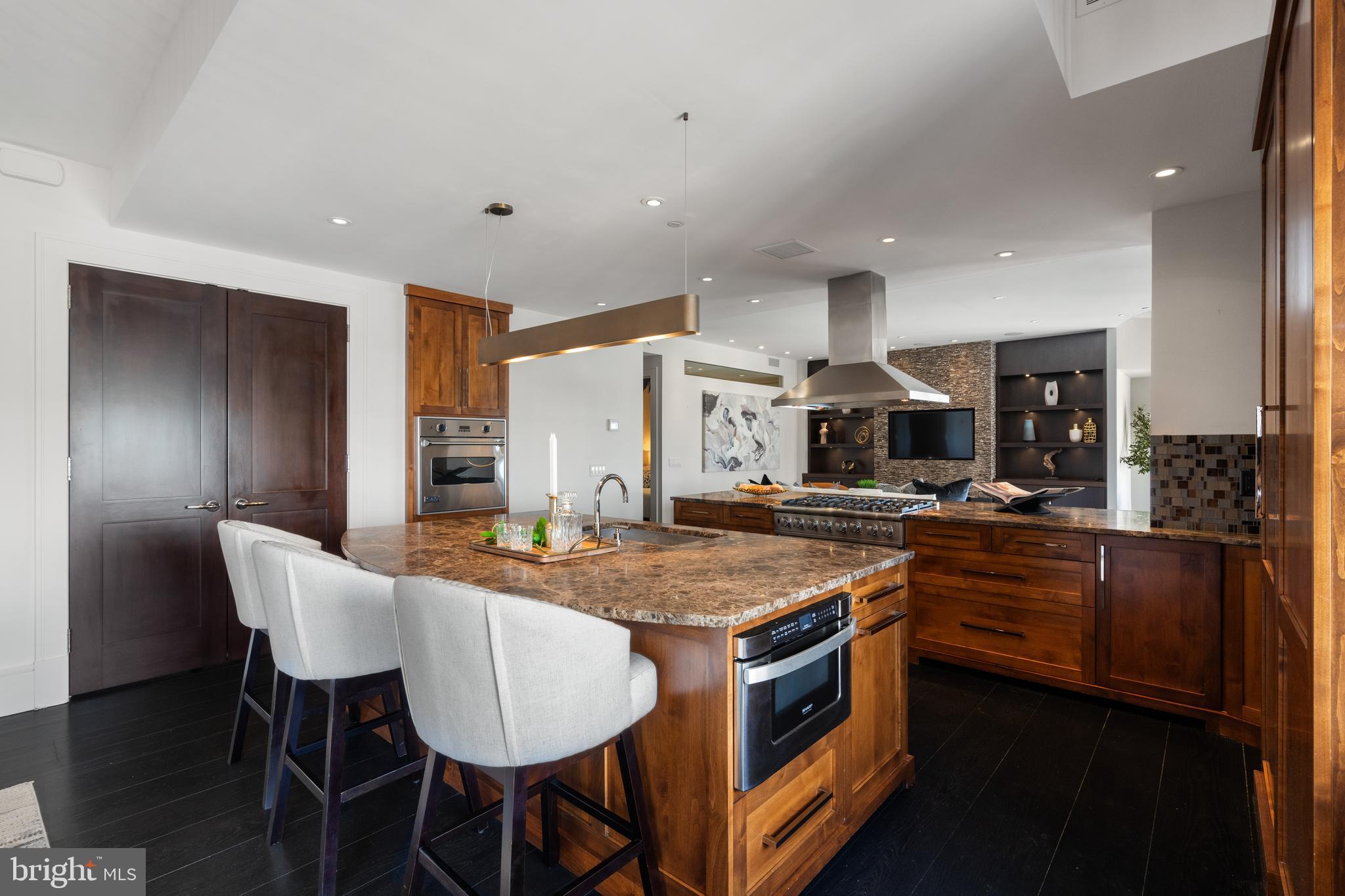 11990 Market Street, Unit 2101 Reston, VA 20190 - Photo 17 of 103 Generous center island with breakfast bar