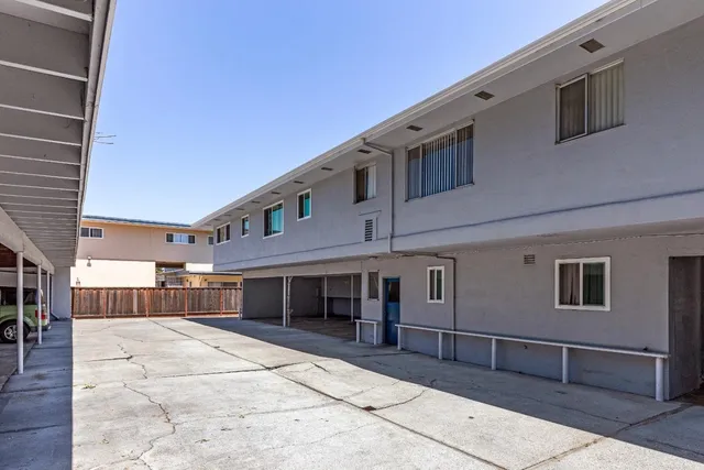 a front view of a building with a lots of windows