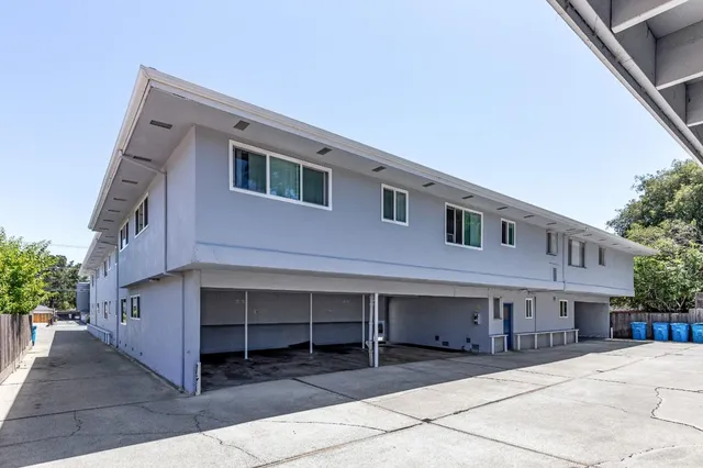 a front view of a building with parking space