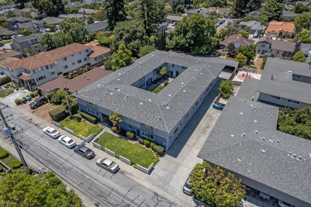an aerial view of a house with a garden