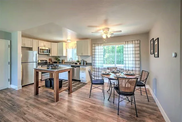a view of a dining room with furniture window and wooden floor