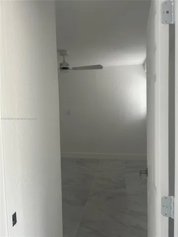 a view of a room that has a window in it