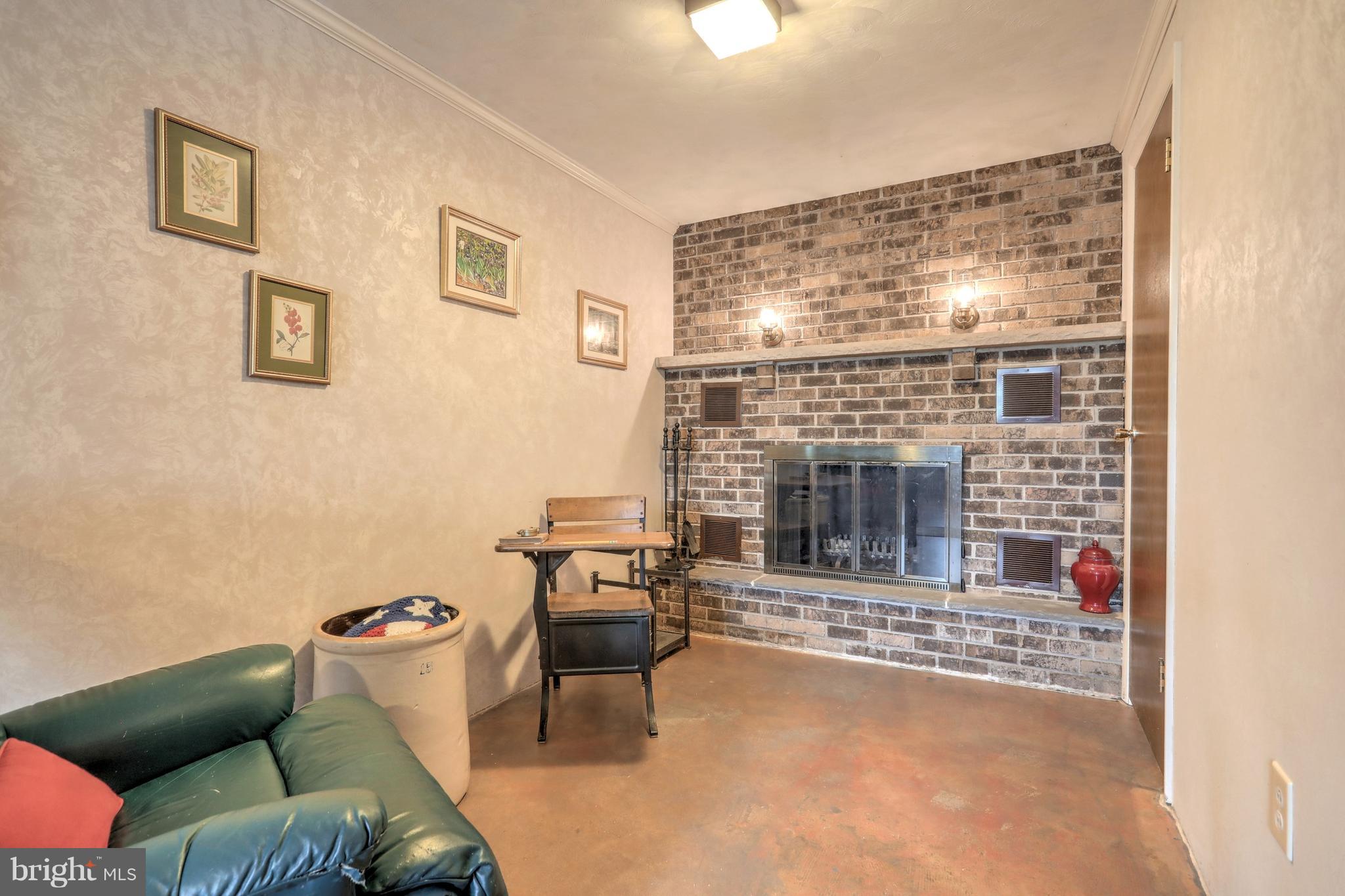 650 Norman Road York, PA 17406 - Photo 17 of 36 LL Family Room Brick Woodburning Fireplace