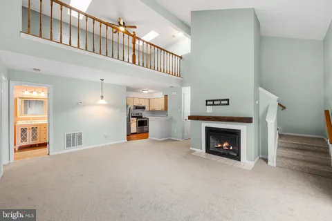 a view of an empty room with a fireplace