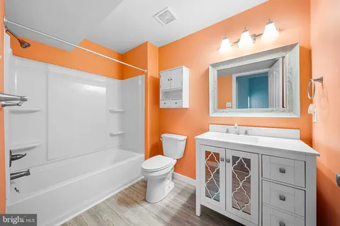 a bathroom with a sink a toilet and a bathtub