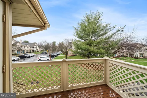 a view of a balcony with yard