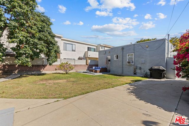 a view of a house with a yard and garage