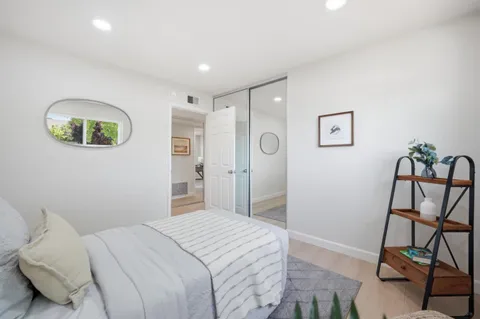 a bedroom with a bed and a view of bathroom