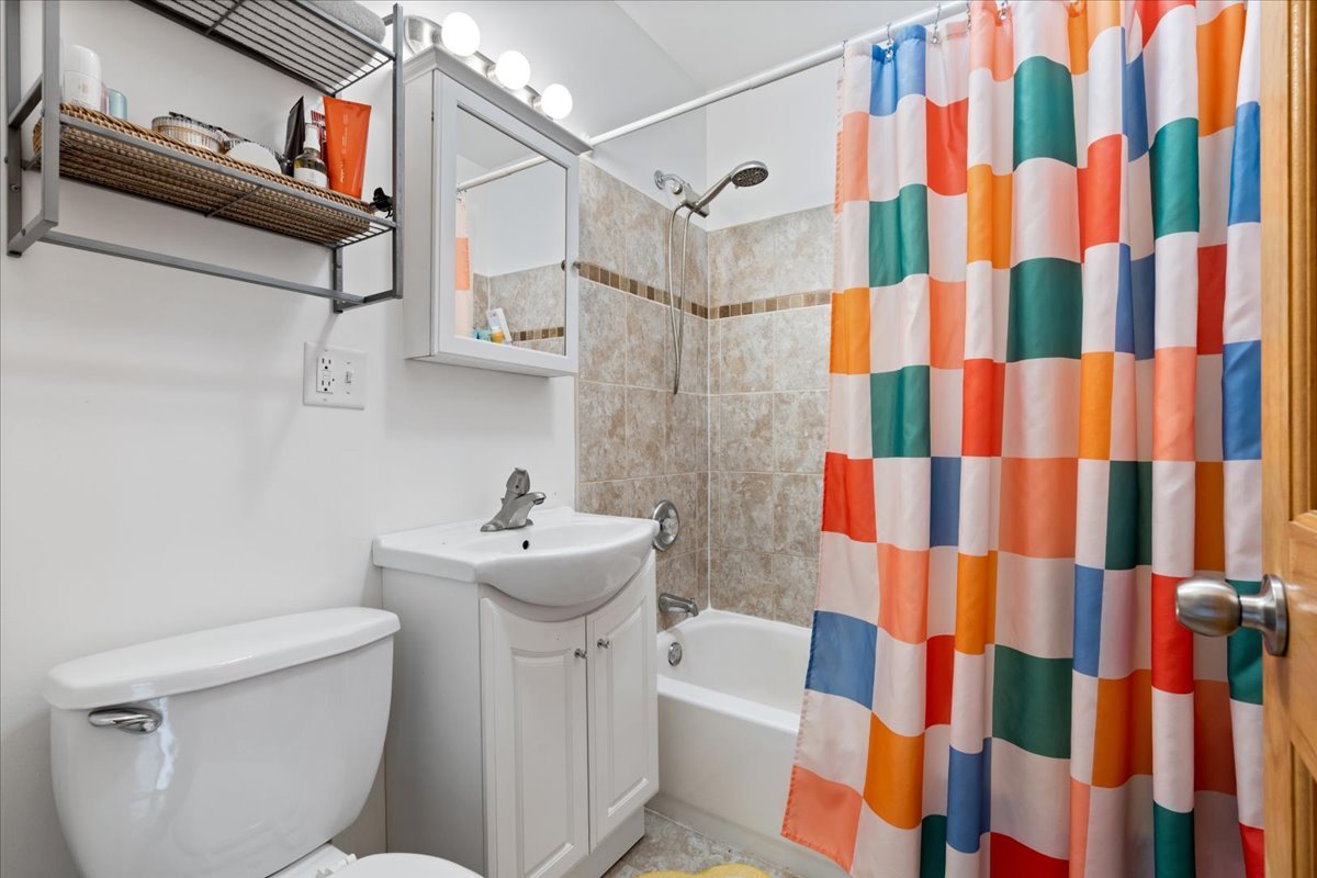 2735 North Ridgeway Avenue Chicago, IL 60647 - Photo 29 of 40 a bathroom with a sink toilet and shower